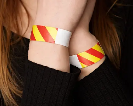 Red and yellow striped paper wristbands